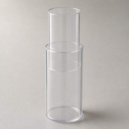 Clear plastic telescoping cylinder with the inner tube raised